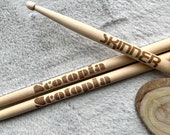 Custom engraved maple wood drumsticks, perfect for drummers and musicians. Personalize with any name or text in various fonts and typography. A unique gift for groomsmen, dads, boyfriends, husbands, or band members. Crafted from durable maple wood fo thumbnail 1